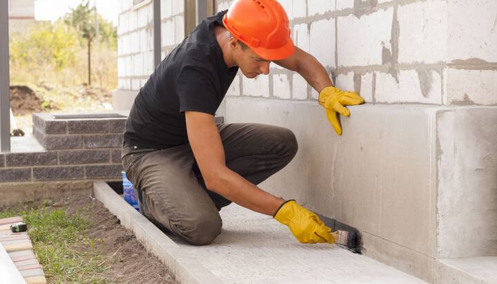 A contract worker providing waterproofing services in Hamilton, NY.