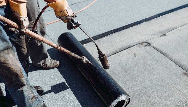 Service professionals providing roof waterproofing in Hamilton, NY.